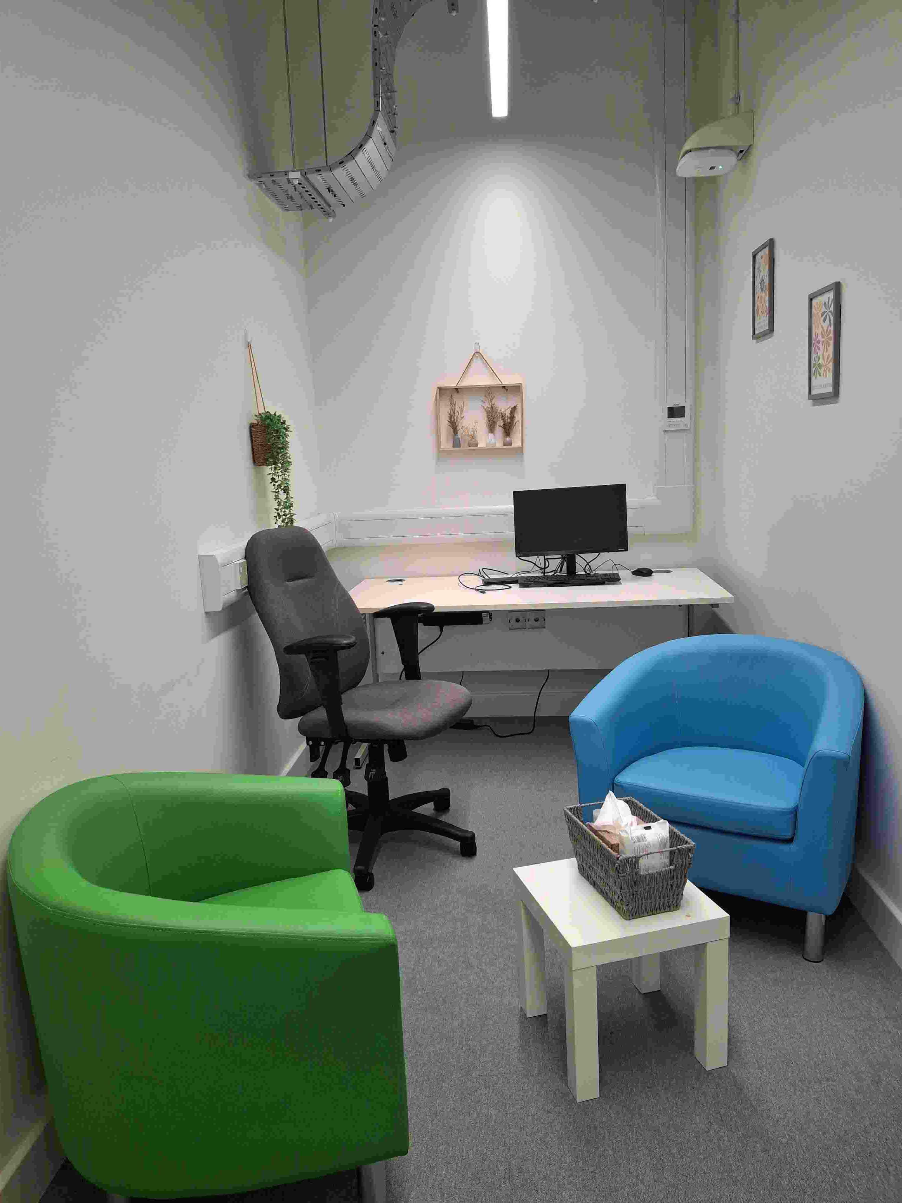 A photograph of one of the rooms in the community safety hub showing comfy chairs